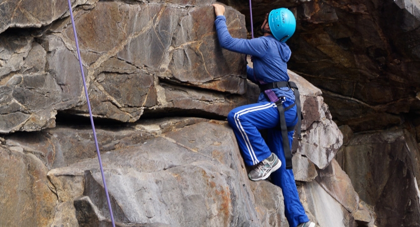 teens learn rock climbing skills in maine